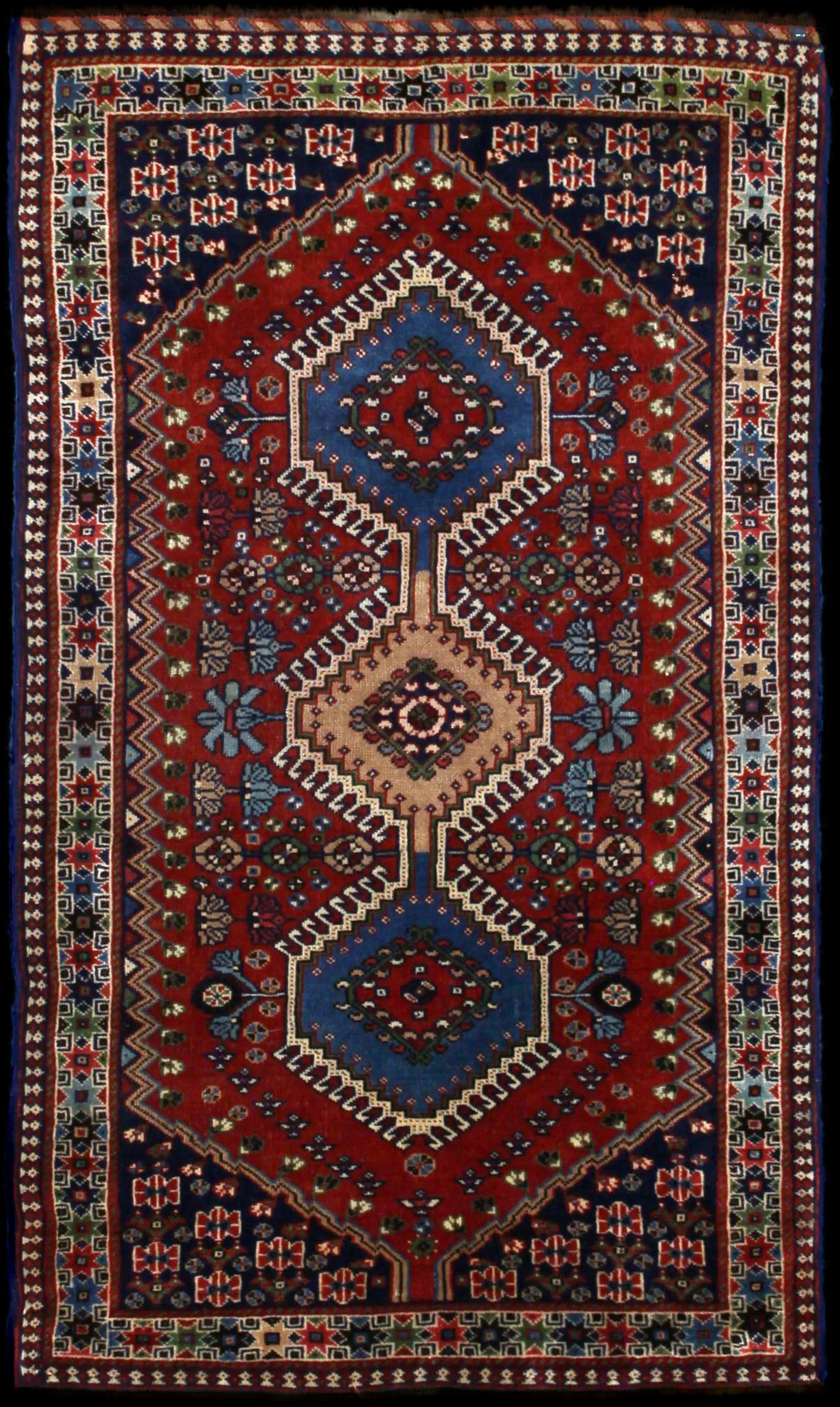 Handmade Persian rug in dimensions 148 centimeters length by 85 centimetres width with mainly Blue and Orange colors