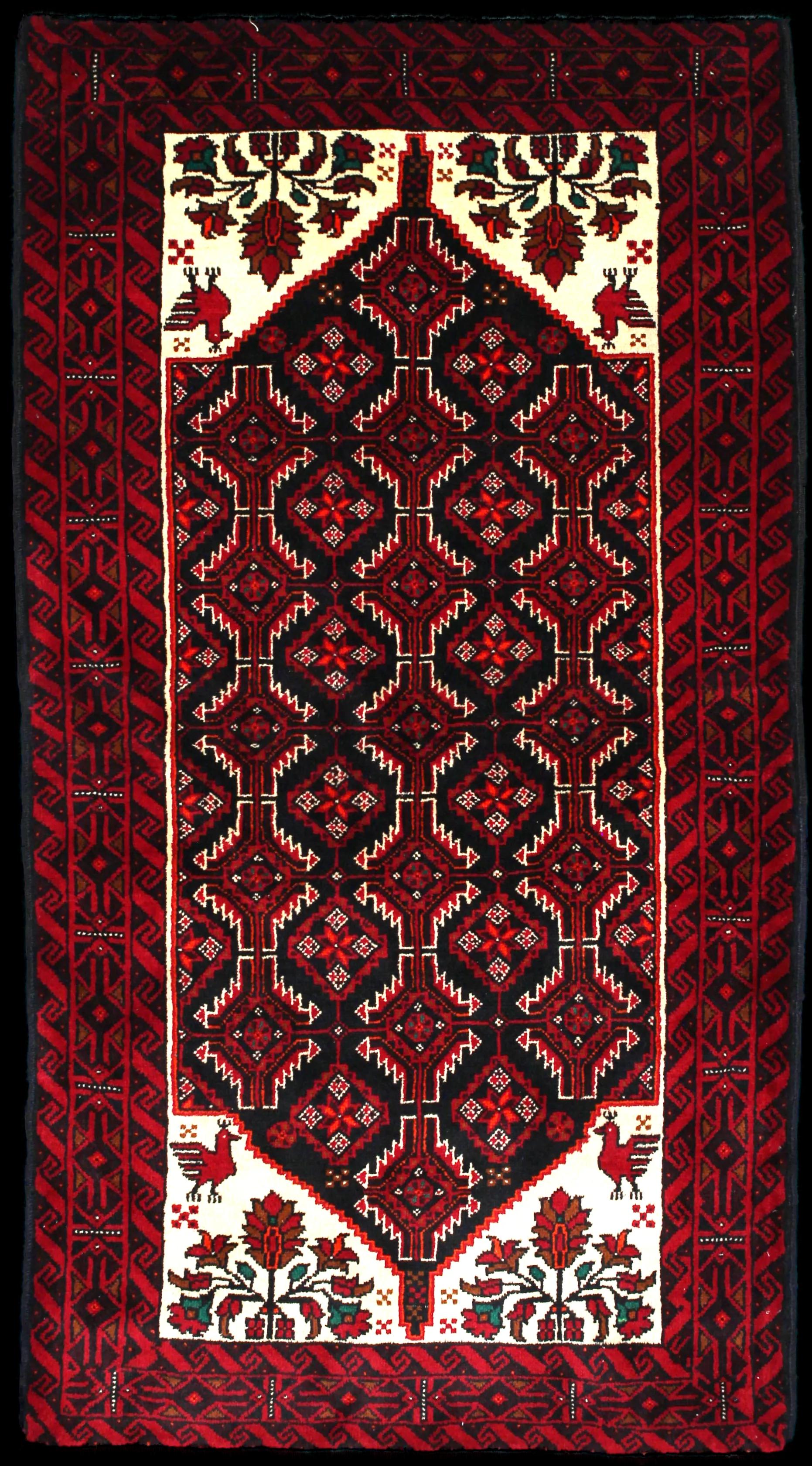 Handmade Persian rug of Baluch style in dimensions 194 centimeters length by 105 centimetres width with mainly Red and Black colors