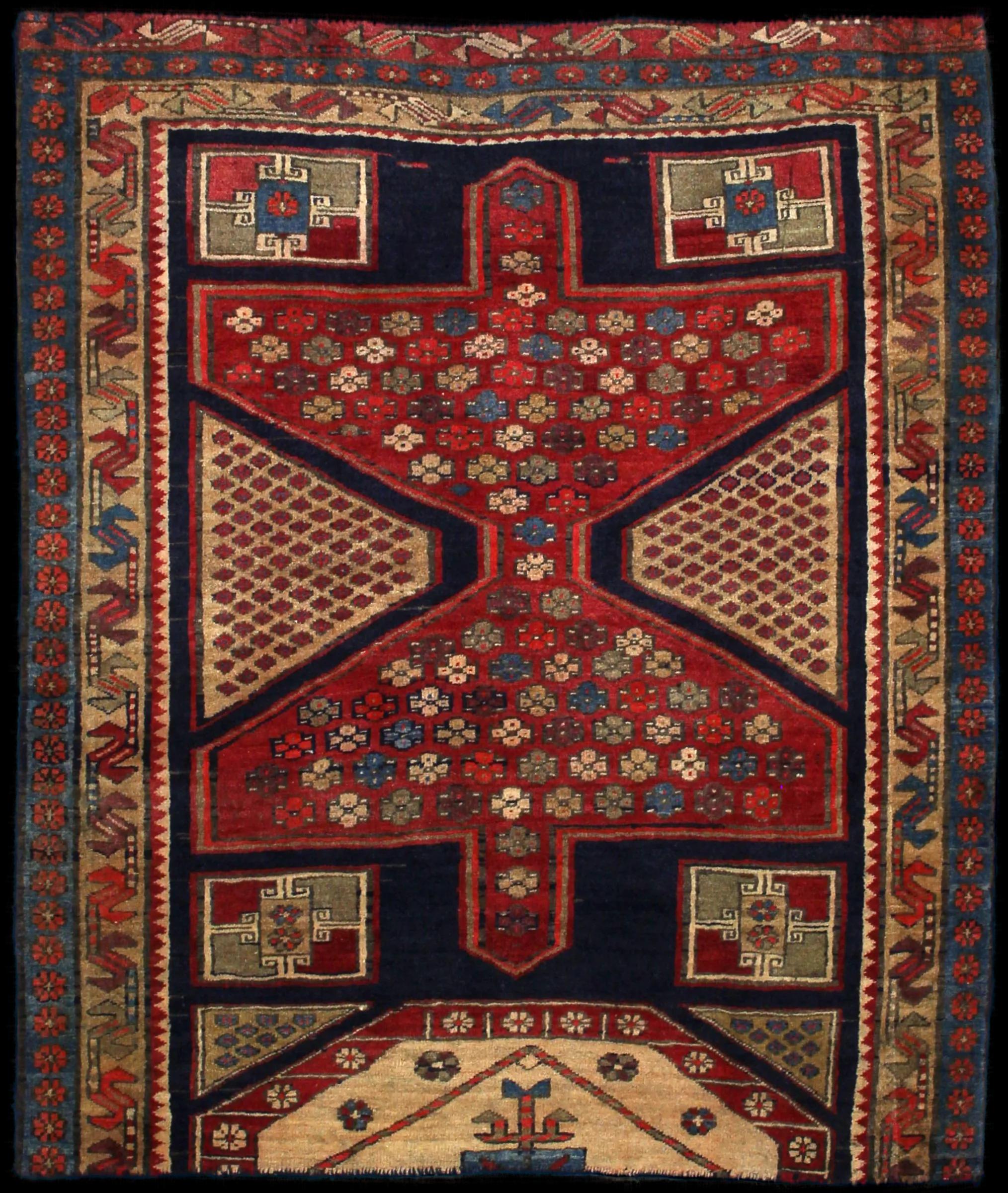 Handmade Perse rug in dimensions 134 centimeters length by 116 centimeters width with mainly Bleu et Rouge colors